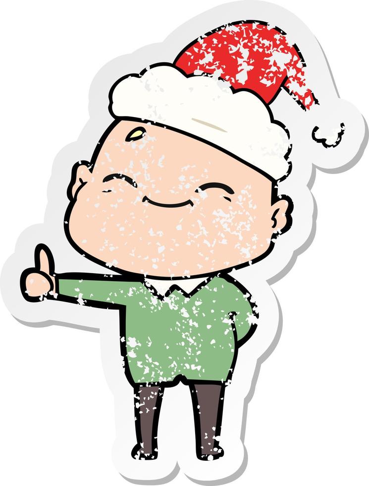 happy distressed sticker cartoon of a bald man wearing santa hat vector
