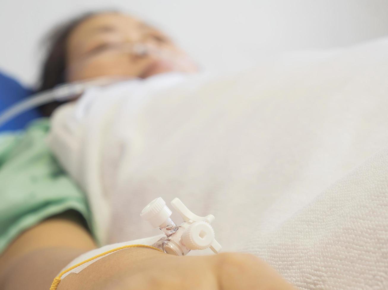 A patient is receiving medication via intravenous therapy photo