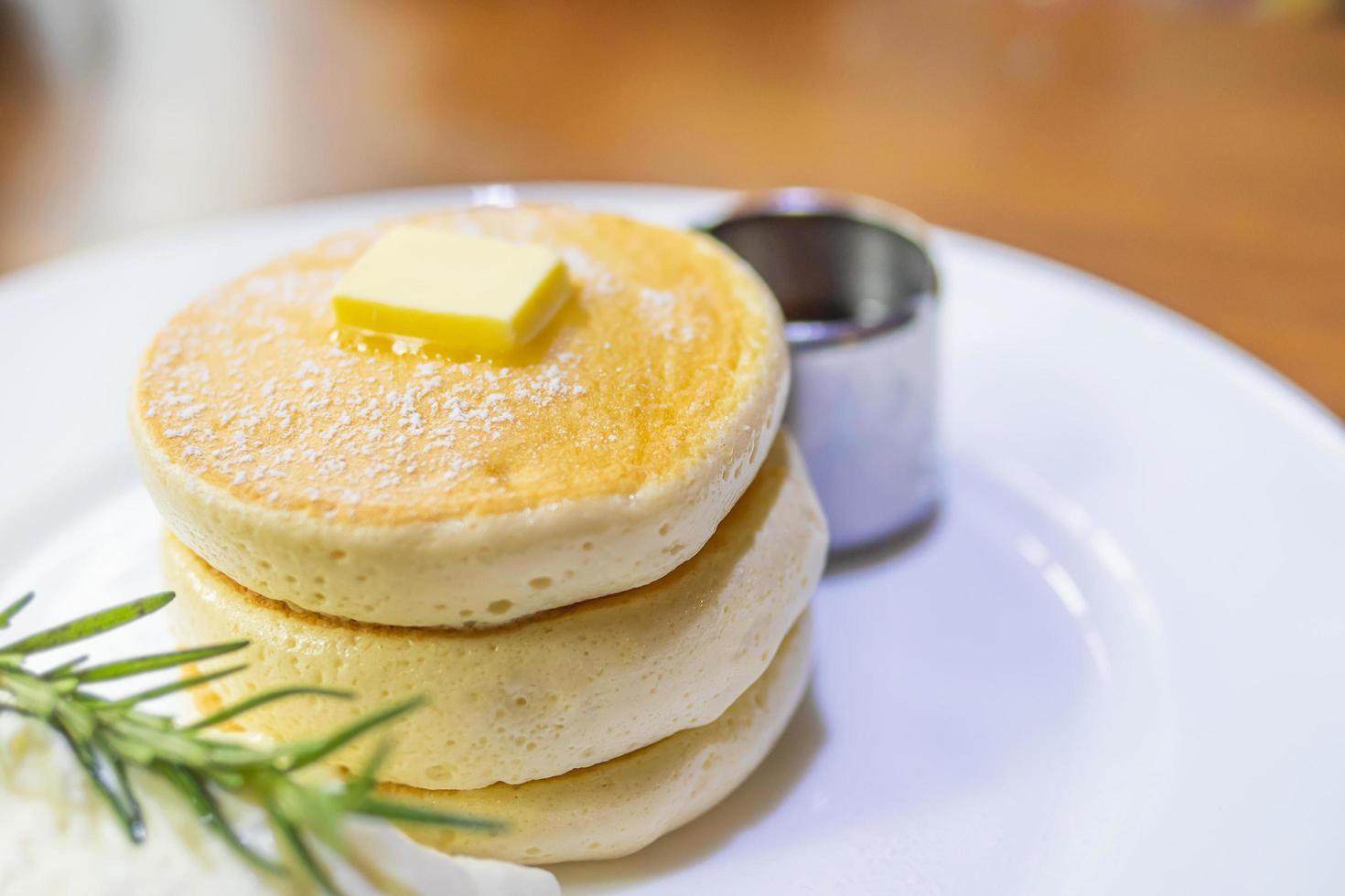 pancake with melted butter and syrup on top photo