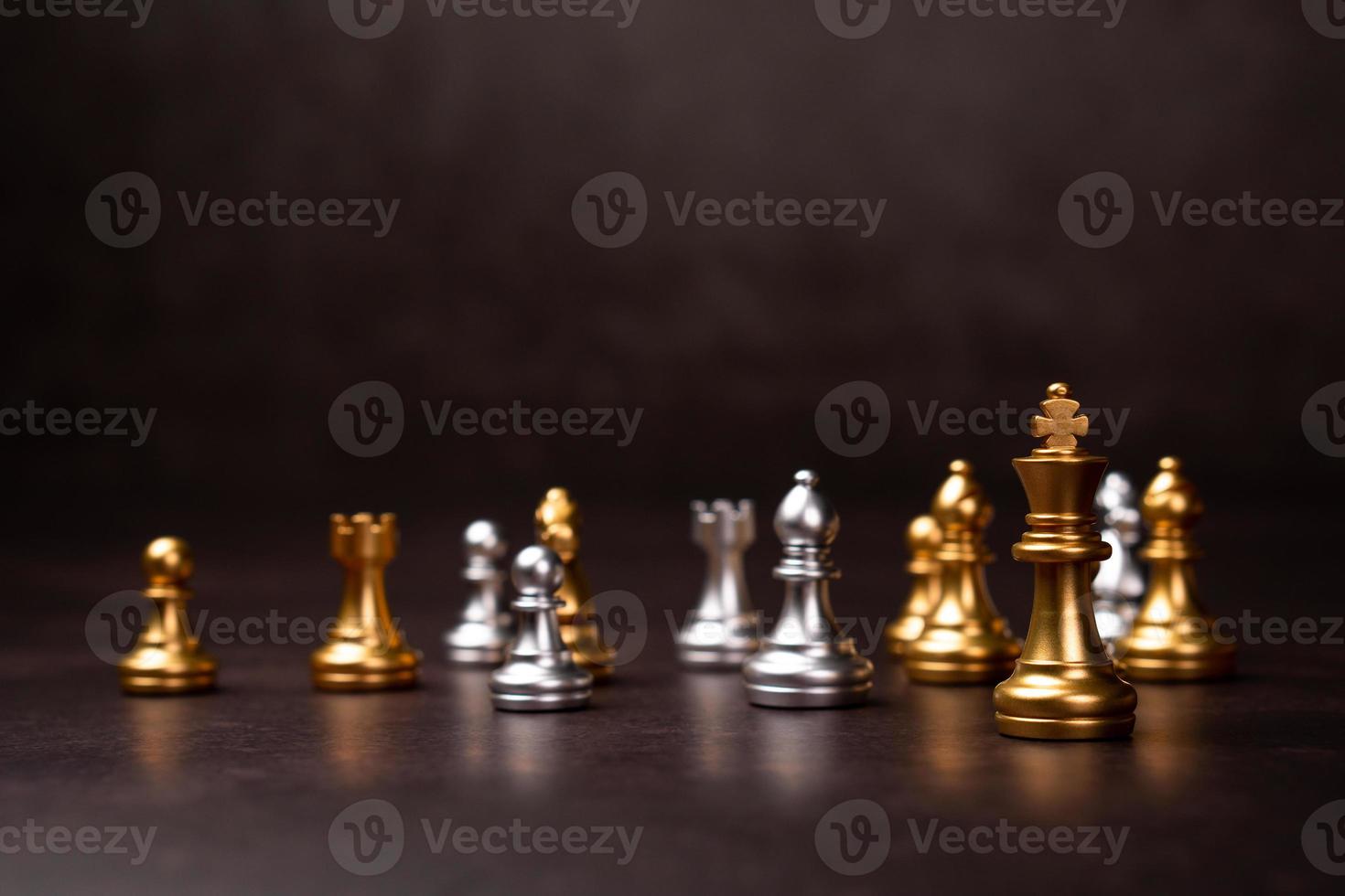 Golden Chess King standing to Be around of other chess, Concept of a leader must have courage and challenge in the competition, leadership and business vision for a win in business games photo