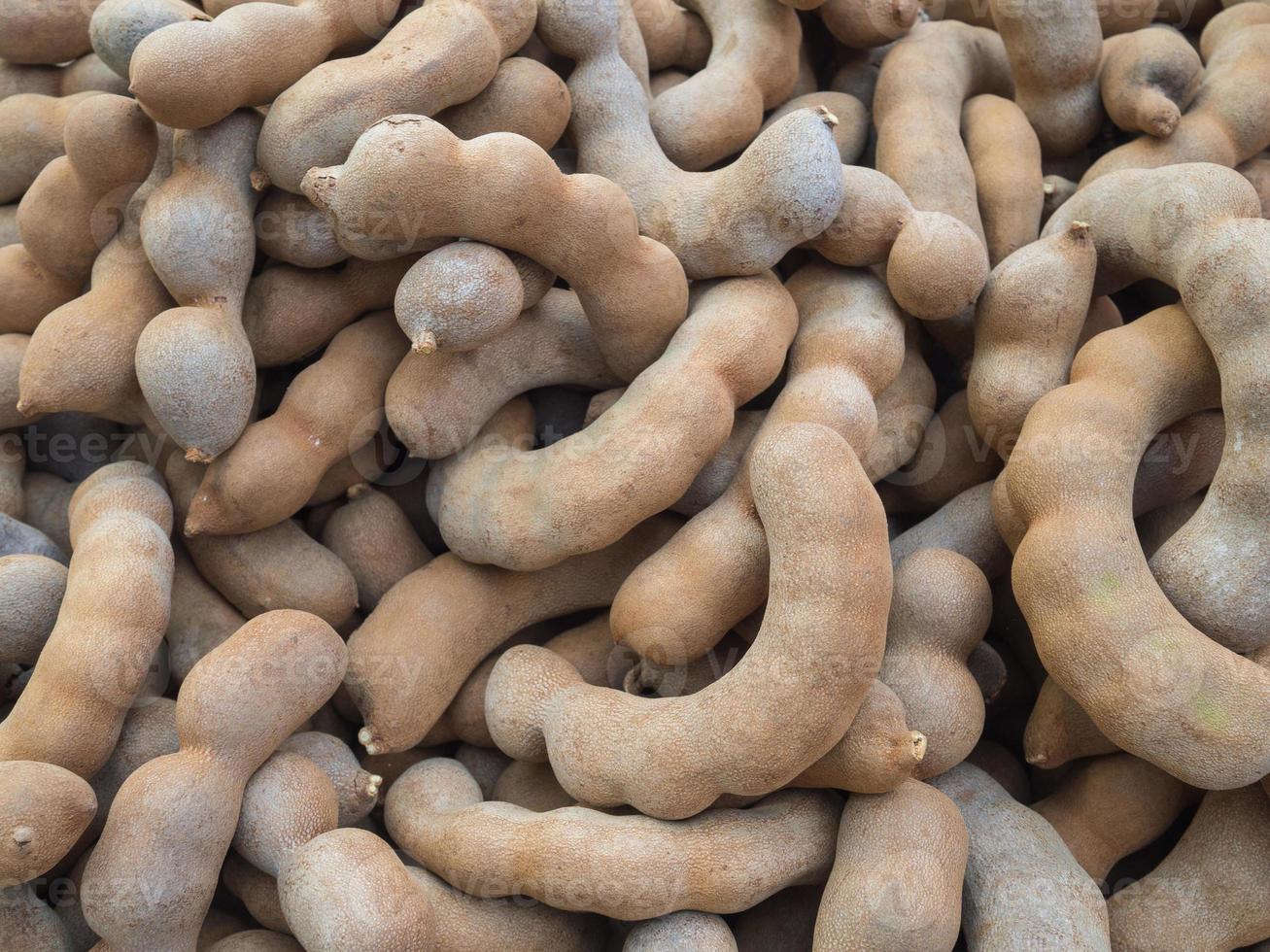 Pile of sweet tamarind for sale in the market photo