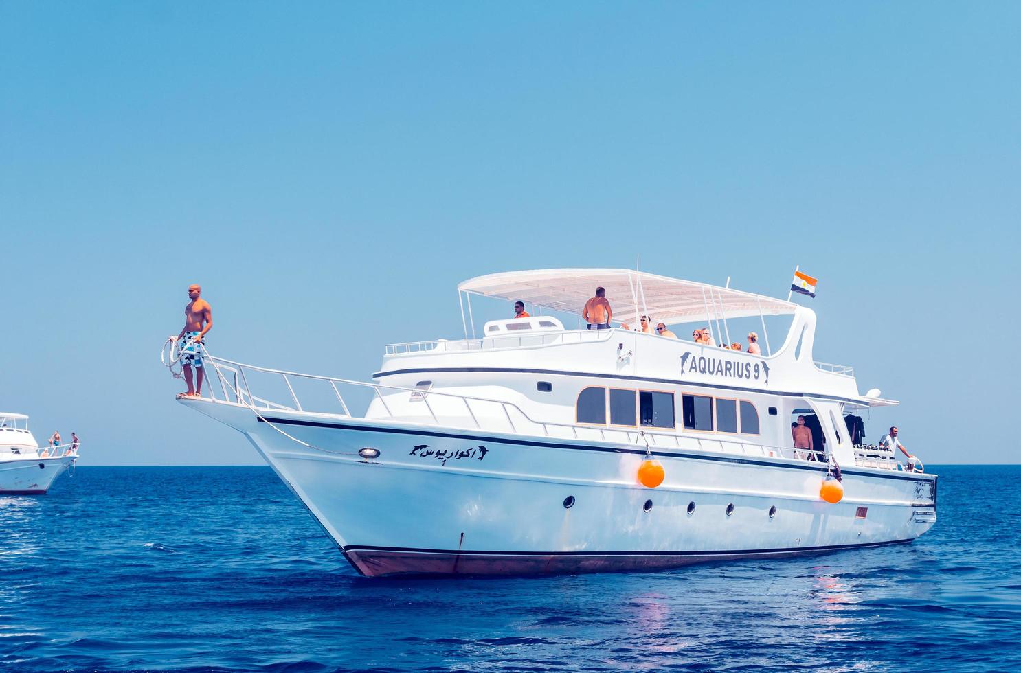 Hurghada, Egypt. August 3, 2014 - White ship with divers moored near a coral reef photo
