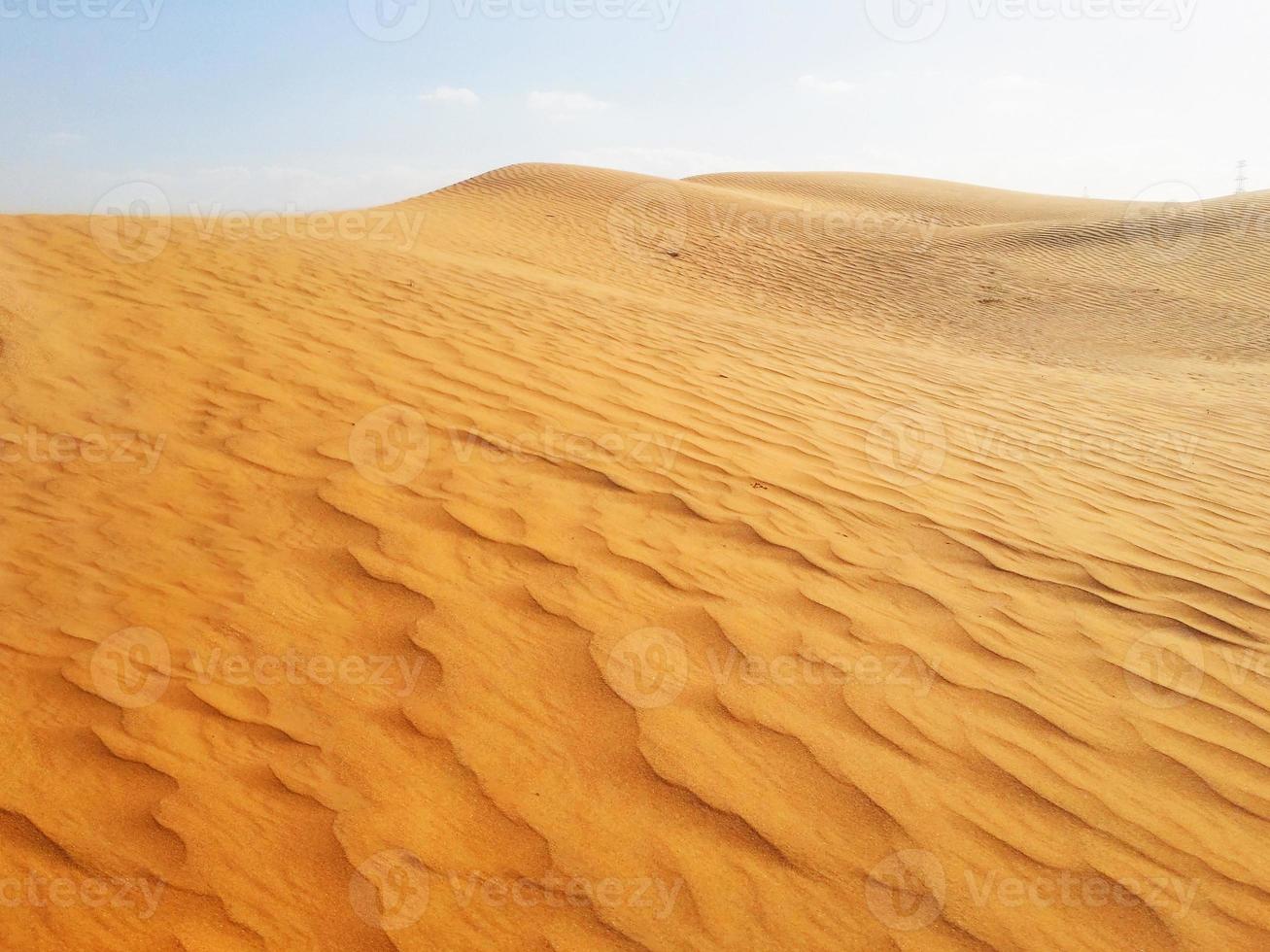 Sand dunes in the desert photo