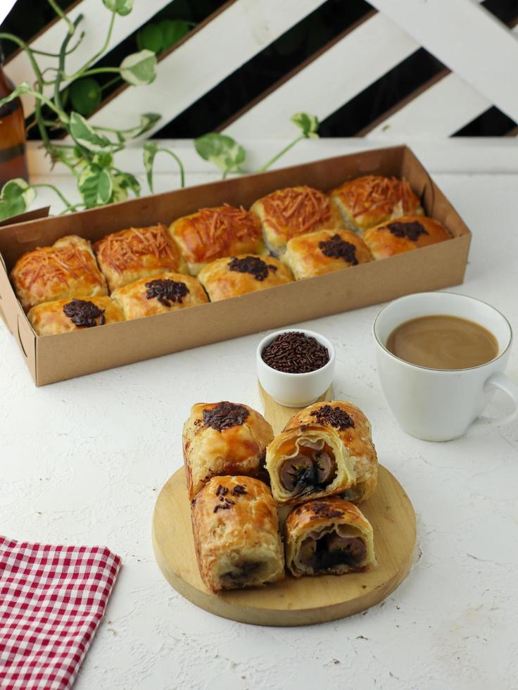 Milk chocolate ball snack bread enjoyed with a glass of milk coffee photo