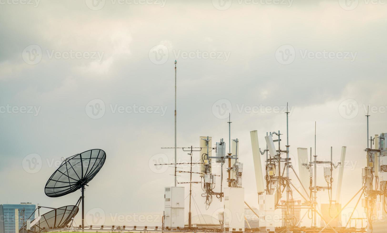 Telecommunication equipment for 5g radio network. Telecommunication tower, antenna, and satellite dish. Antenna for wireless network. Broadcasting tower for internet communication. Broadcast antenna. photo