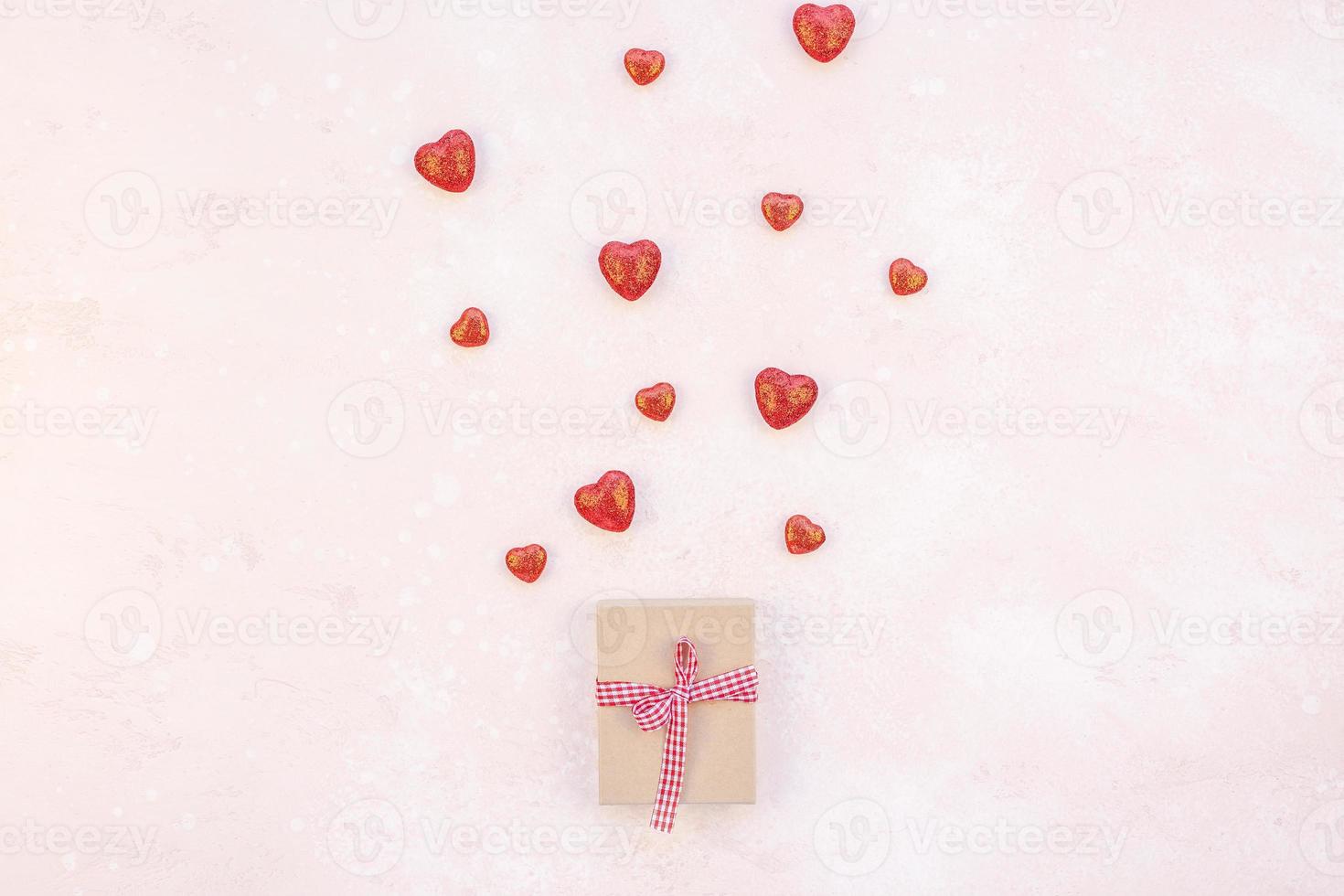 Valentine Day composition with hearts and gift box photo