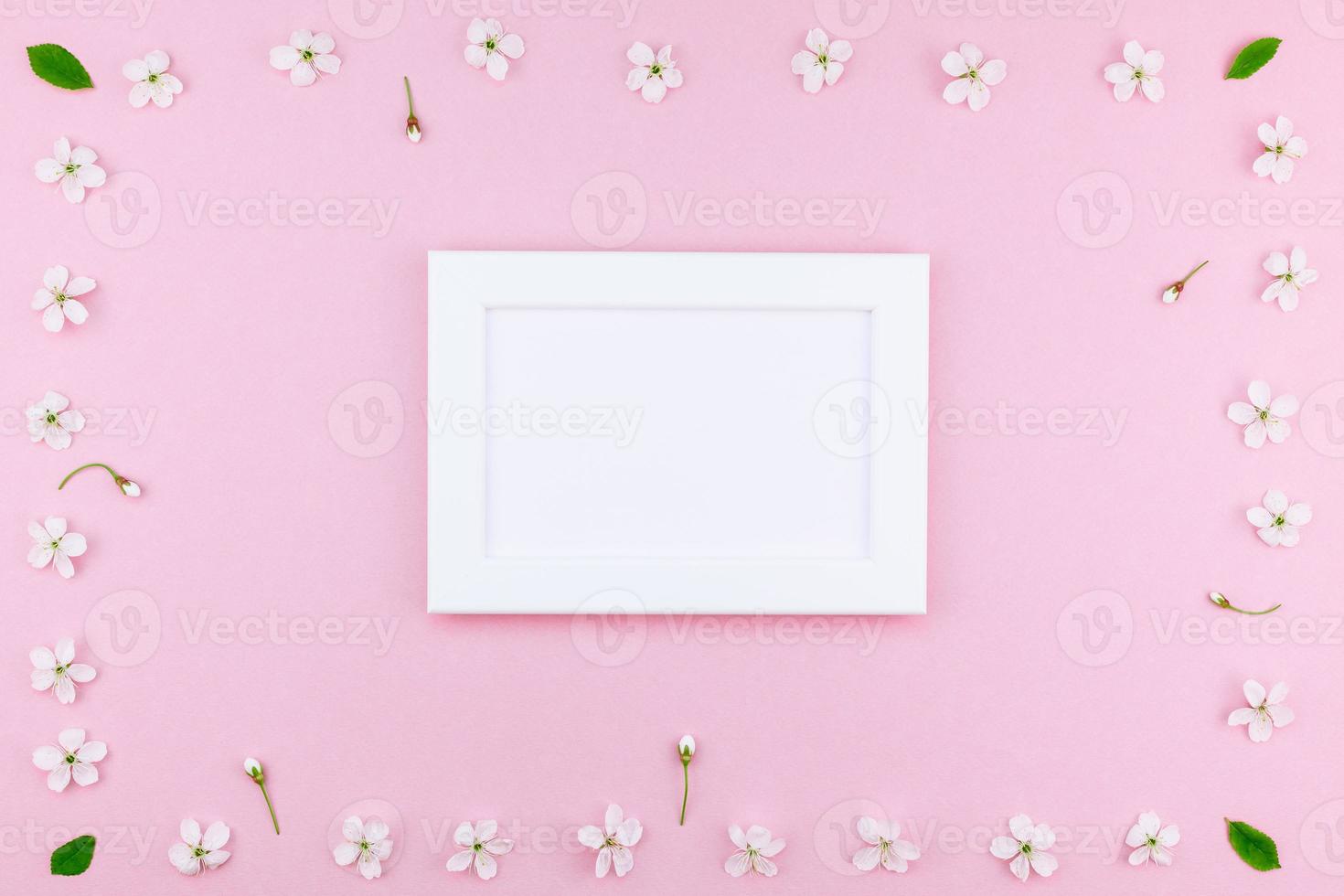 Blank frame mockup with white flowers photo