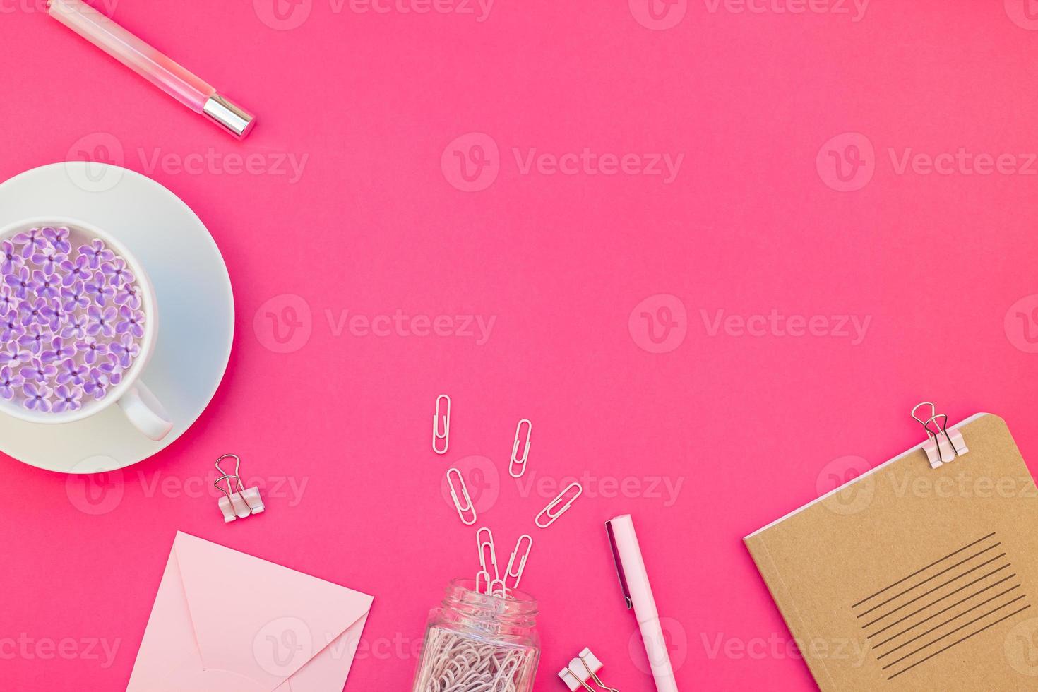 Styled pink feminine workspace flat lay photo
