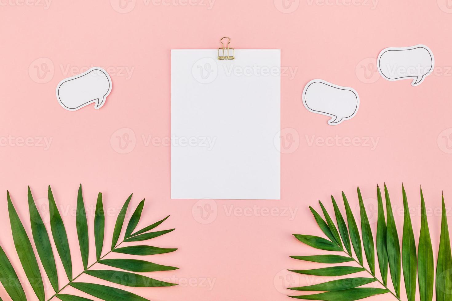 Clip board mock up with green tropical leaves photo