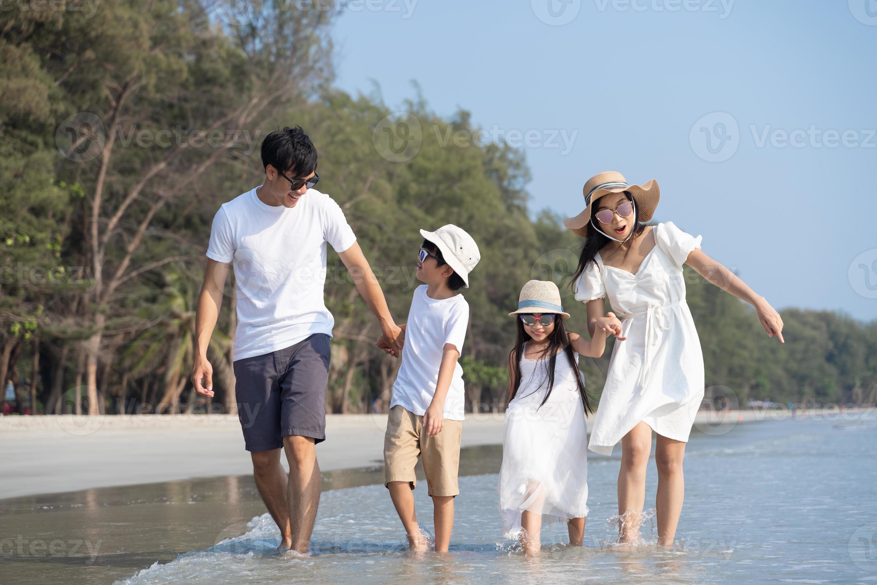 Asian Family Walking At Beach With Kids Happy Vacation Concept 10210023 asian-family-walking-at-beach-with-kids-happy-vacation-concept-10210023