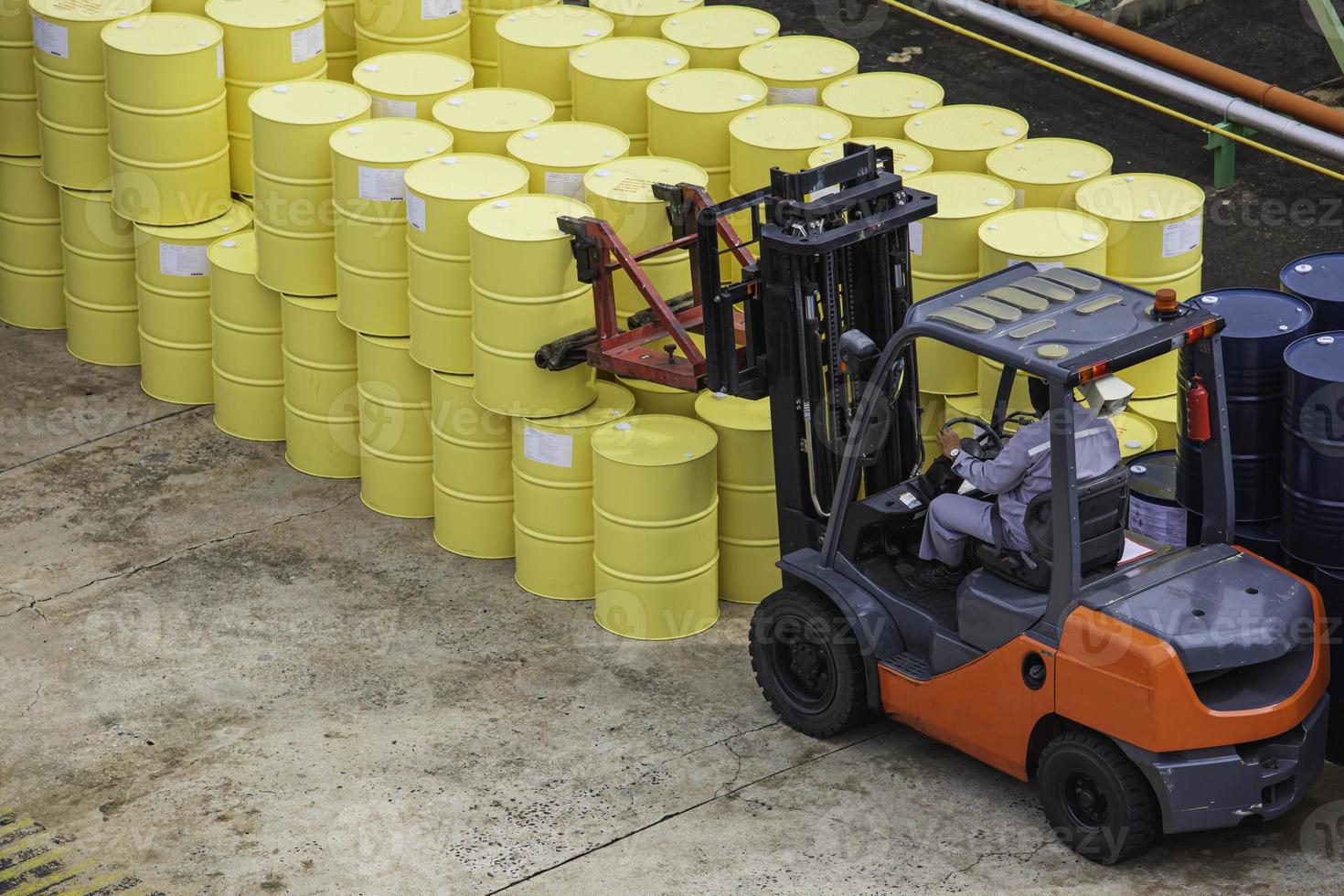 Top view oil barrels forklift truck move for on the transportation. photo