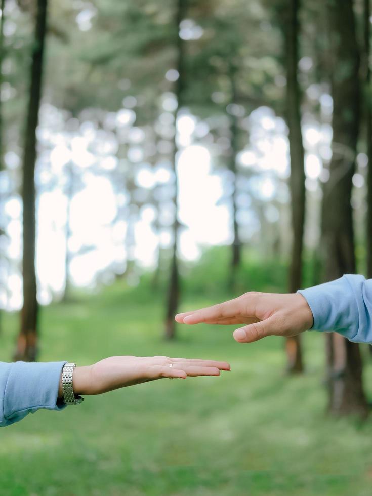 young indonesian couple hand photo