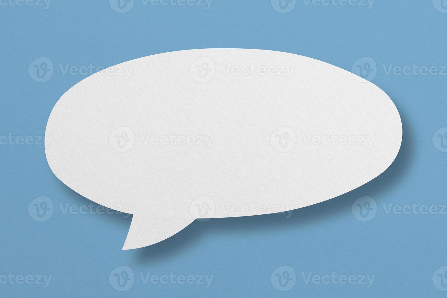 white paper with speech bubbles isolated on blue background communication bubbles photo