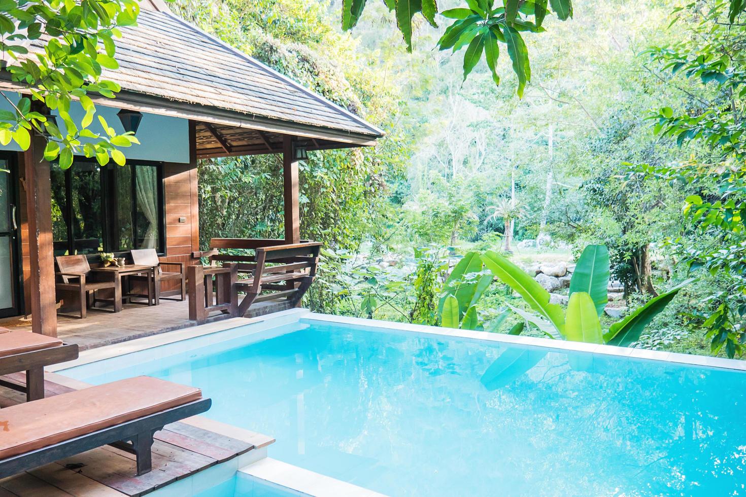 Relax small resort view in green garden forest urban area - small residential area with clean swimming pool holiday background concept photo