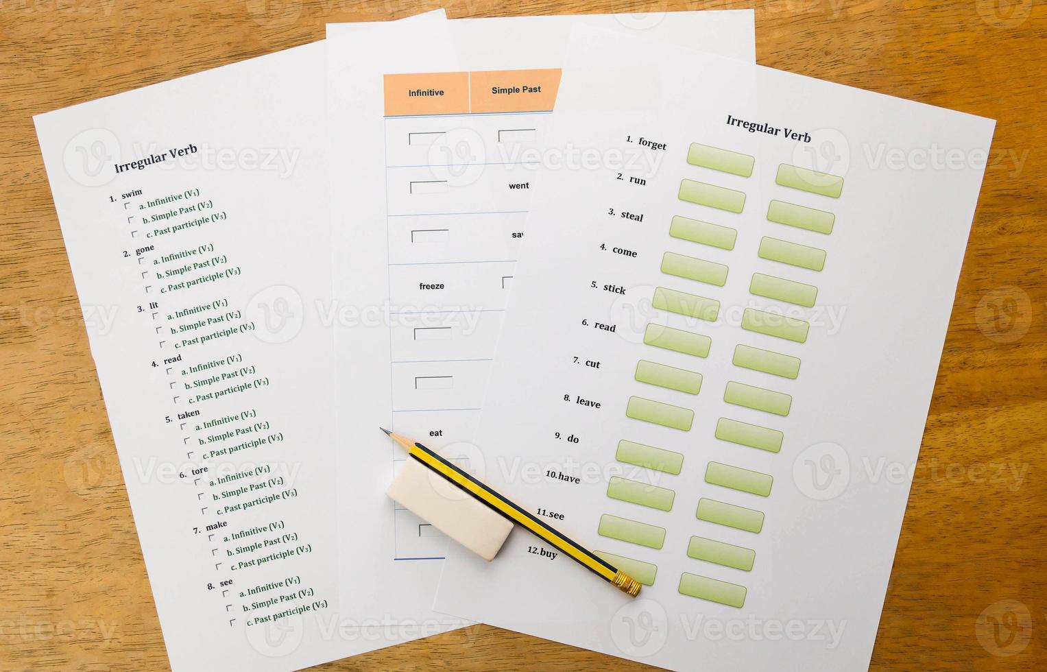 three english exercises on brown wooden table photo