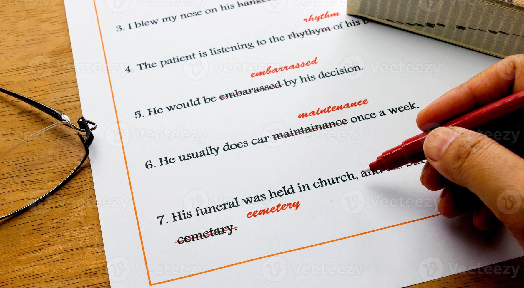 english spelling correction sheet on table photo