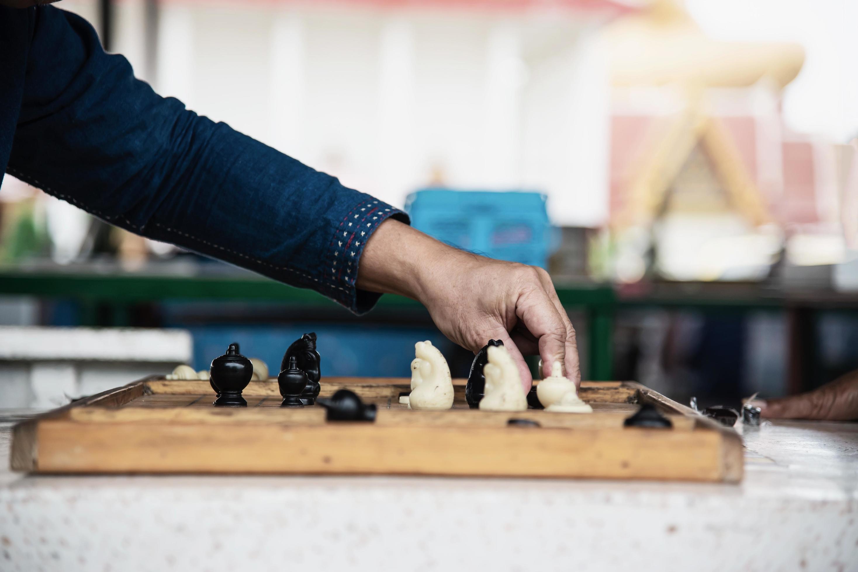 Local Thai people play old traditional Thai chess in public area - slow  life style local people with chess board game concept 10218391 Stock Photo  at Vecteezy