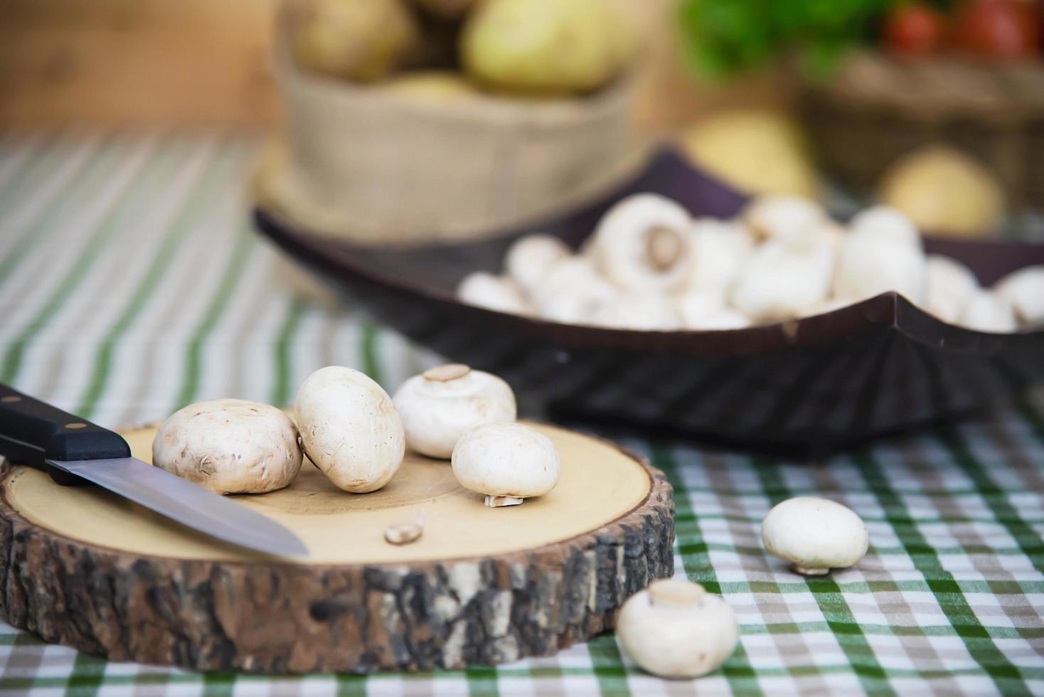 Fresh champignon mushroom vegetable in the kitchen - fresh mushroom vegetable cooking concept photo