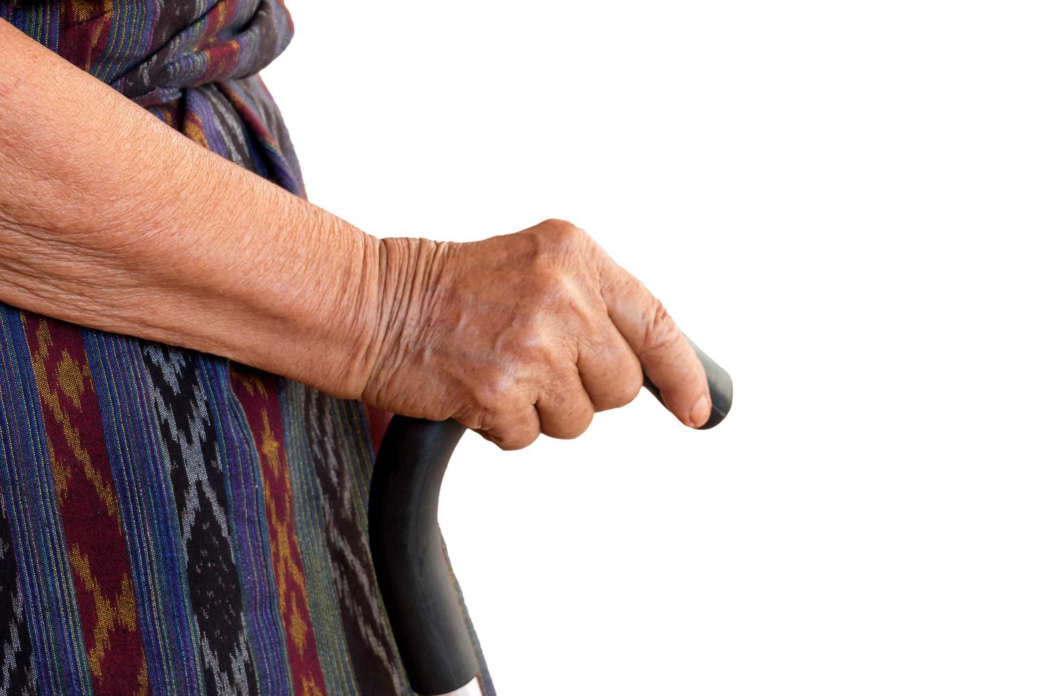 hand holding walking cane photo