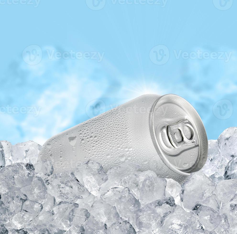 Aluminum Tin Can with ice cubes on blue background. Blank metallic can drink beer soda water juice packaging photo