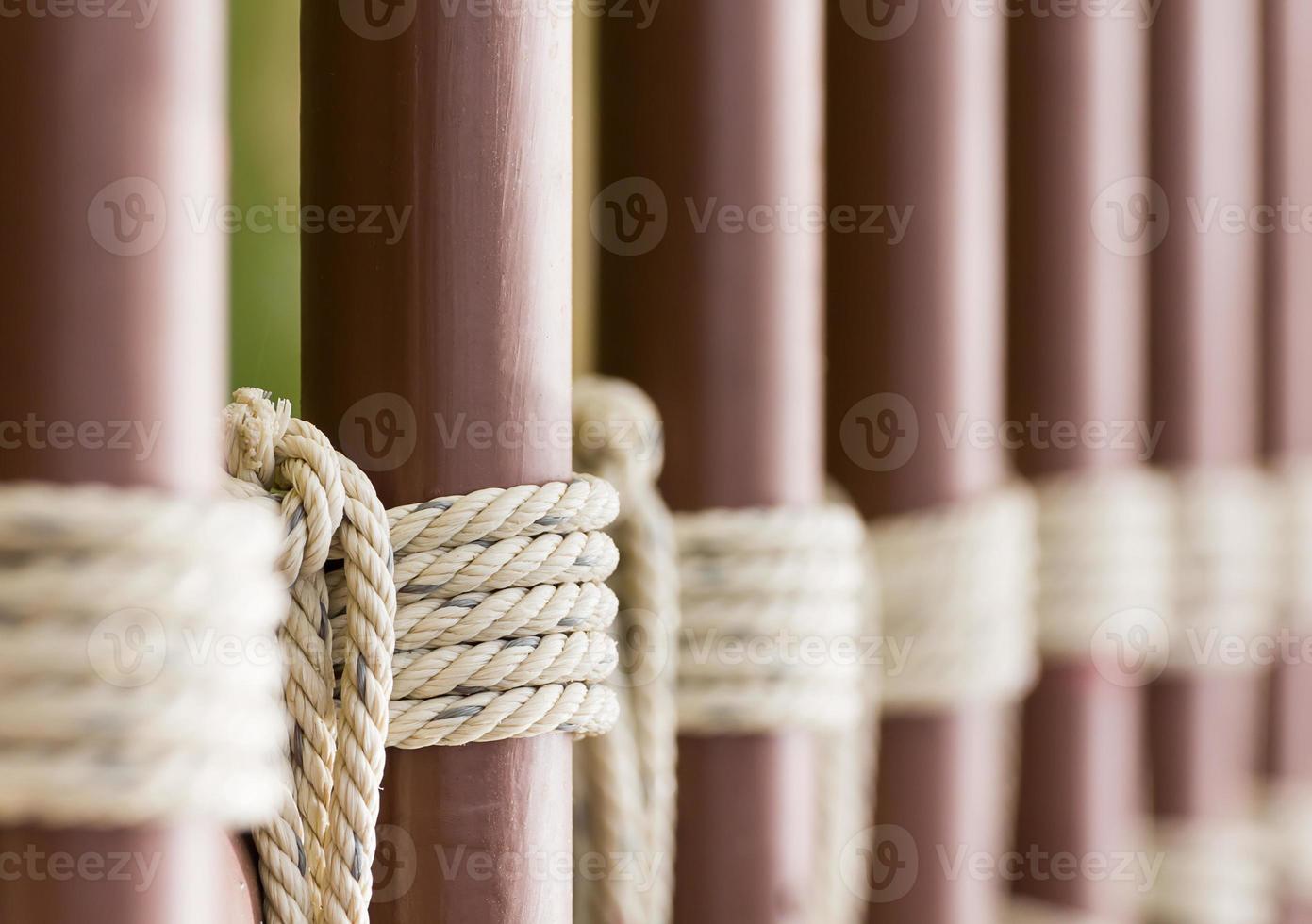 Rope knot around a metal fence photo