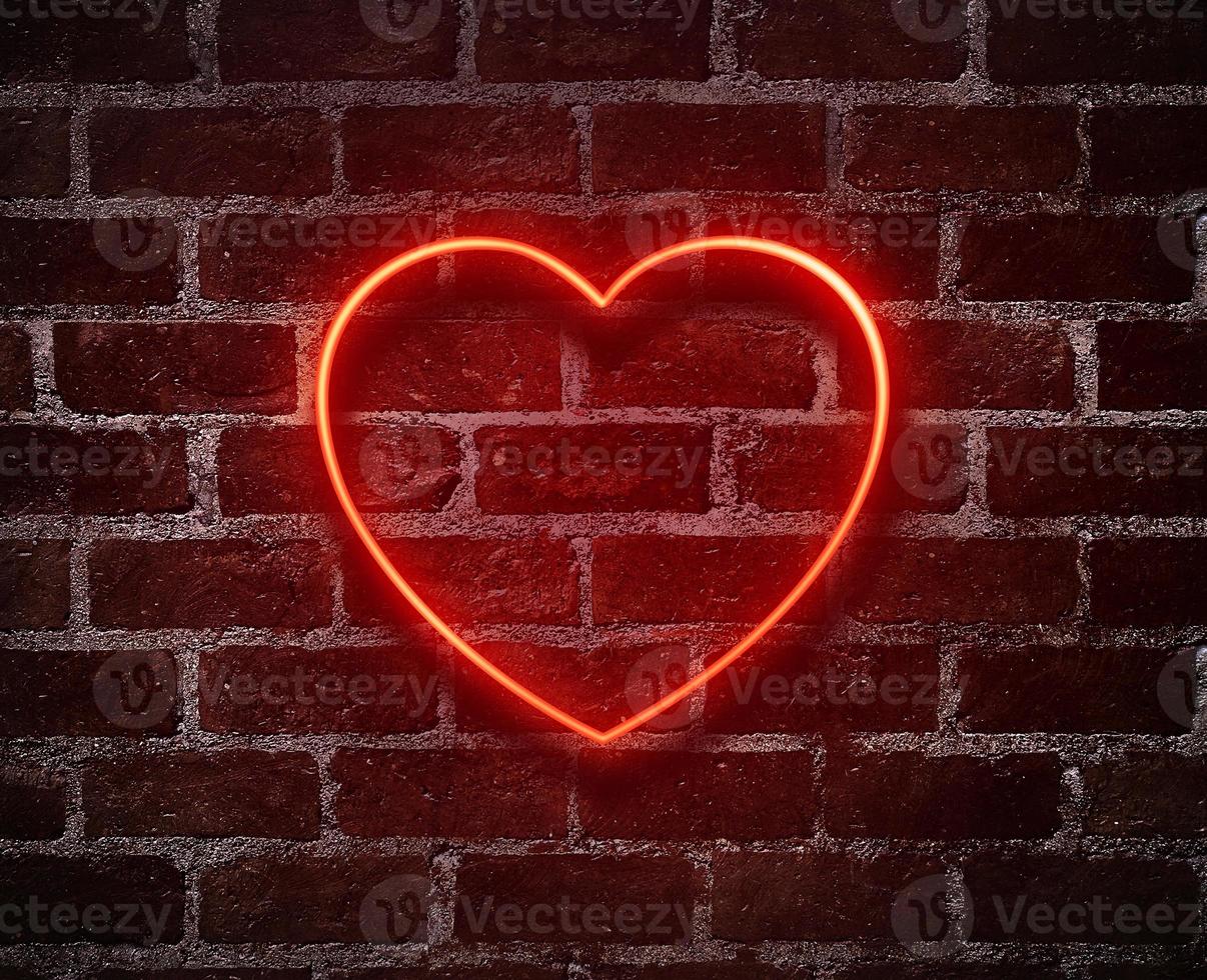 Bright hearts neon sign.Retro red brick wall background background.Happy Valentine's Day design photo