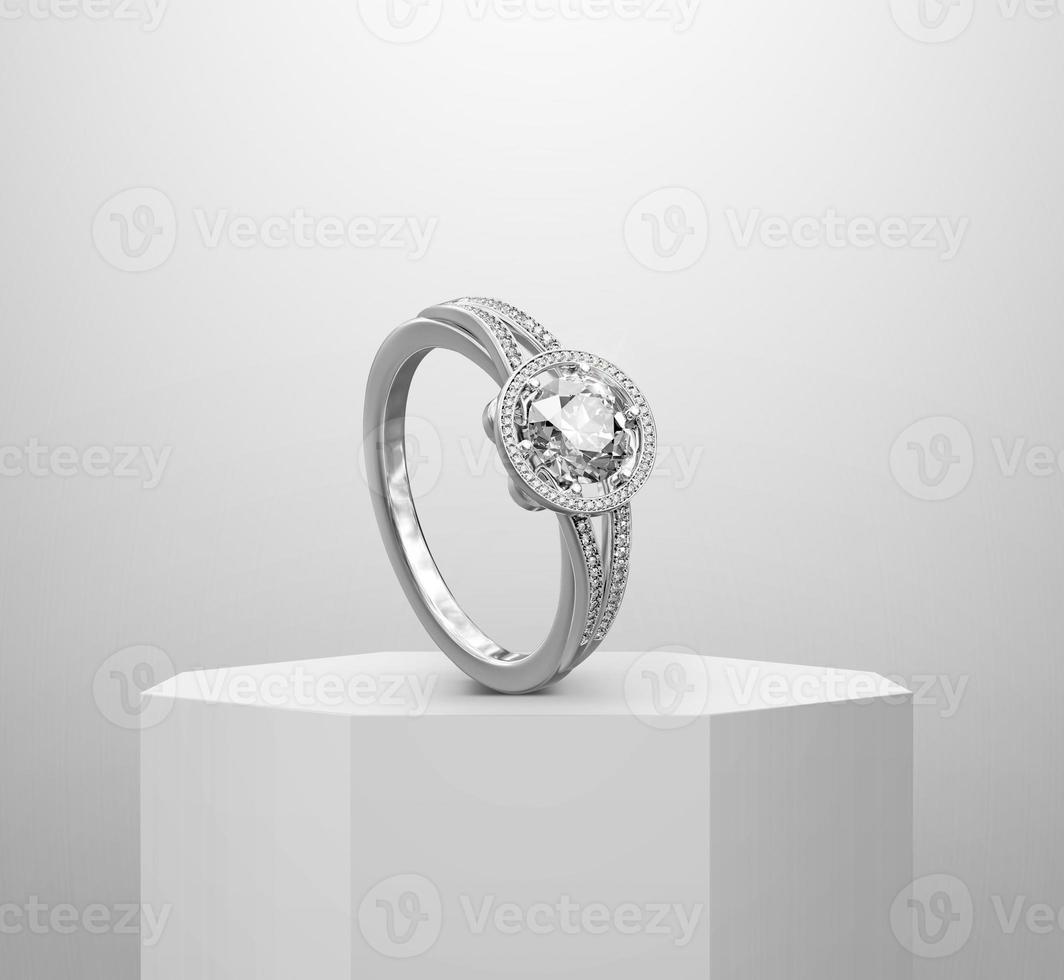 Diamond ring, on Shiny white round pedestal podium photo