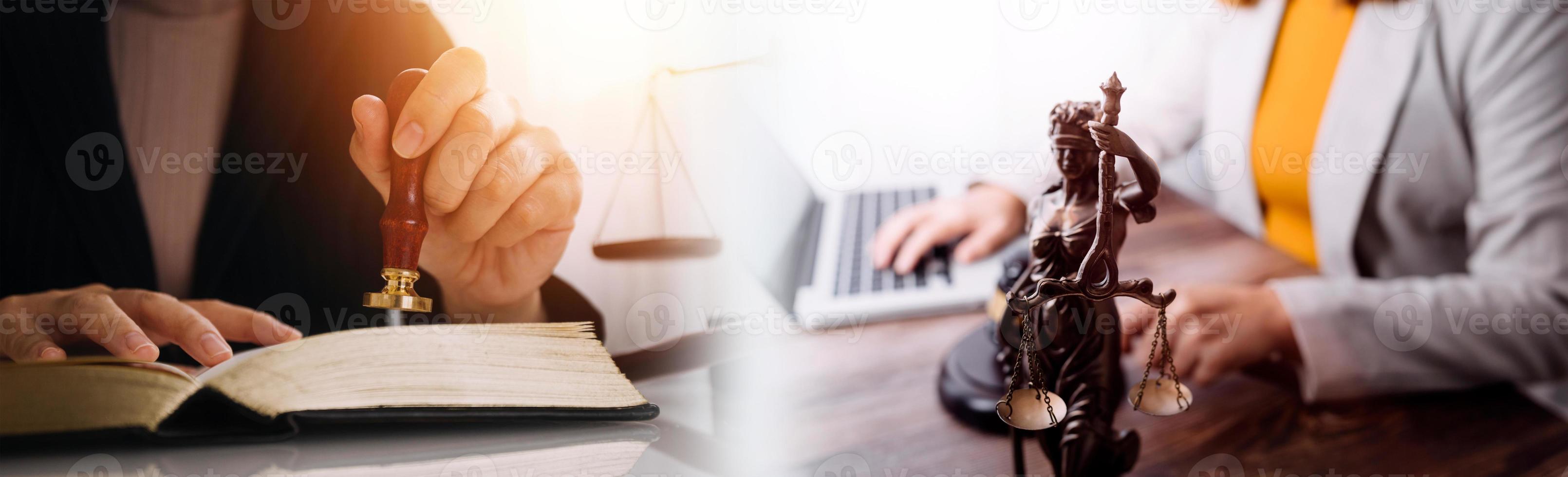 Justice and law concept.Male judge in a courtroom with the gavel, working with, computer and docking keyboard, eyeglasses, on table in morning light photo