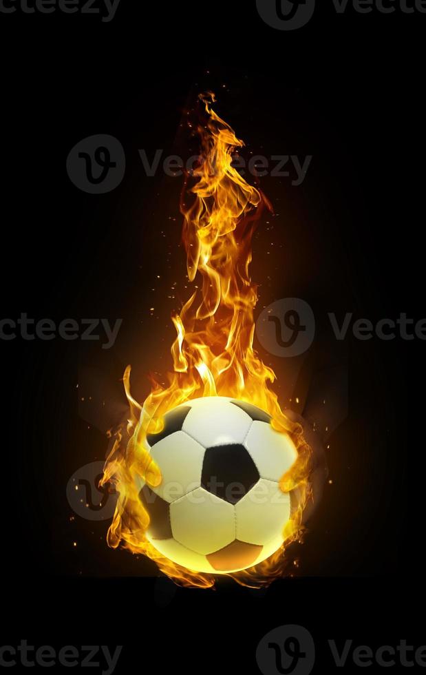 Soccer ball, fire in hand black background photo