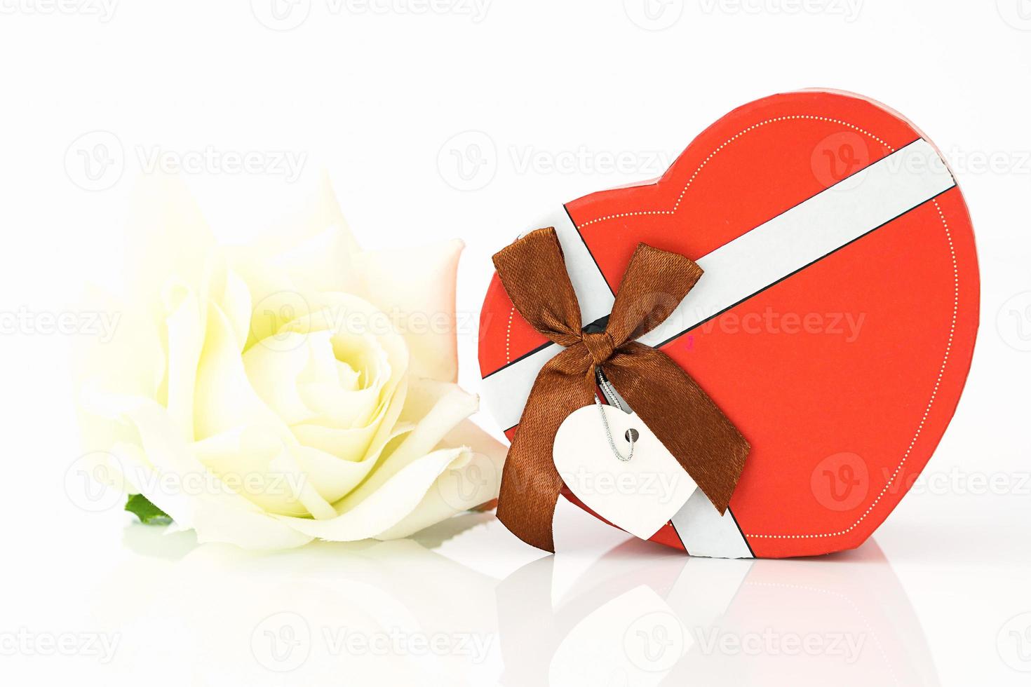 White rose and heart-shaped box photo