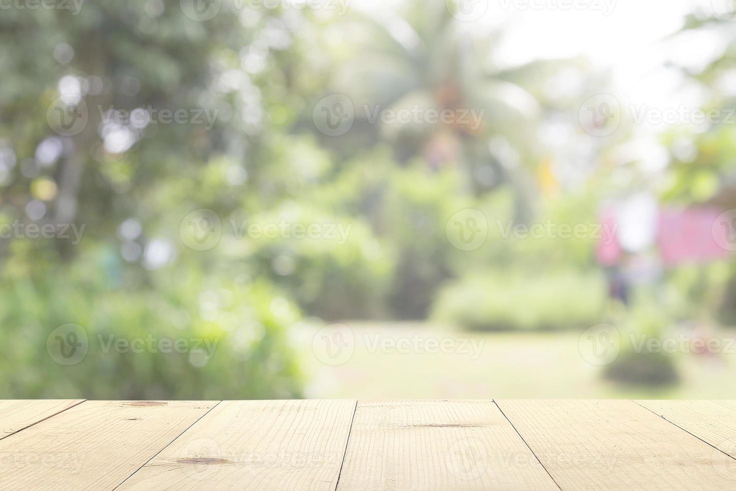 wooden table and backyard blur background photo