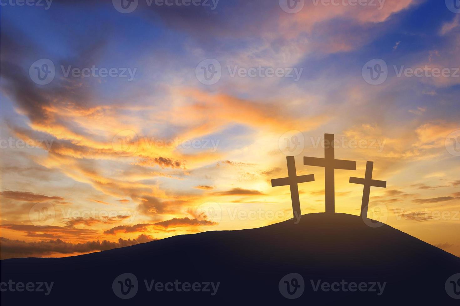 sunrise and cross on mountain photo