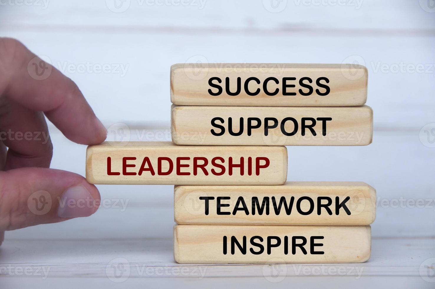 Wooden blocks with text - Success, support, leadership, teamwork, inspire. photo