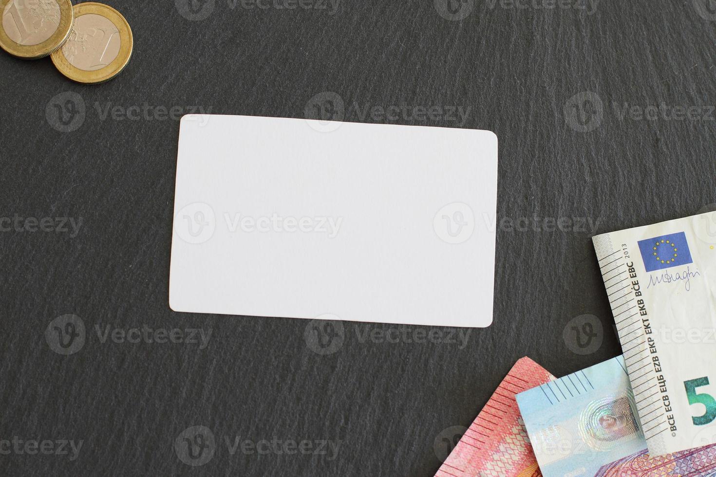 Credit card mock up paper on table with euro money photo