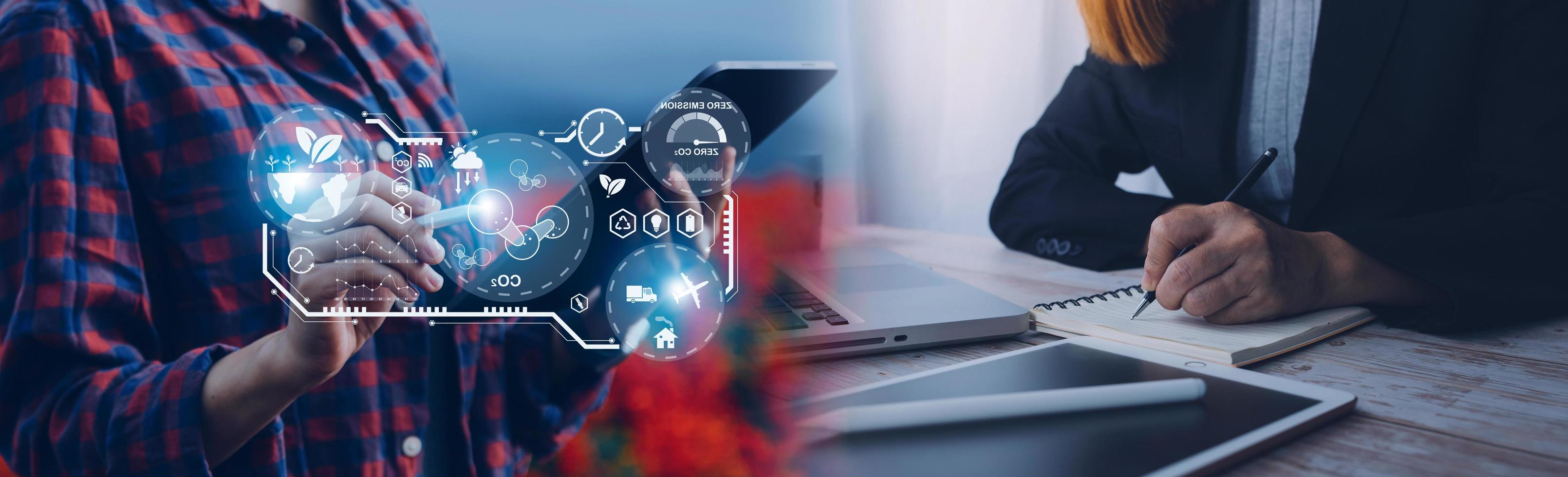 Selective focus. Architect team planning design apply renewable or solar energy on architectural building model with virtual reality technology hologram. Alternative green energy in future concept. photo