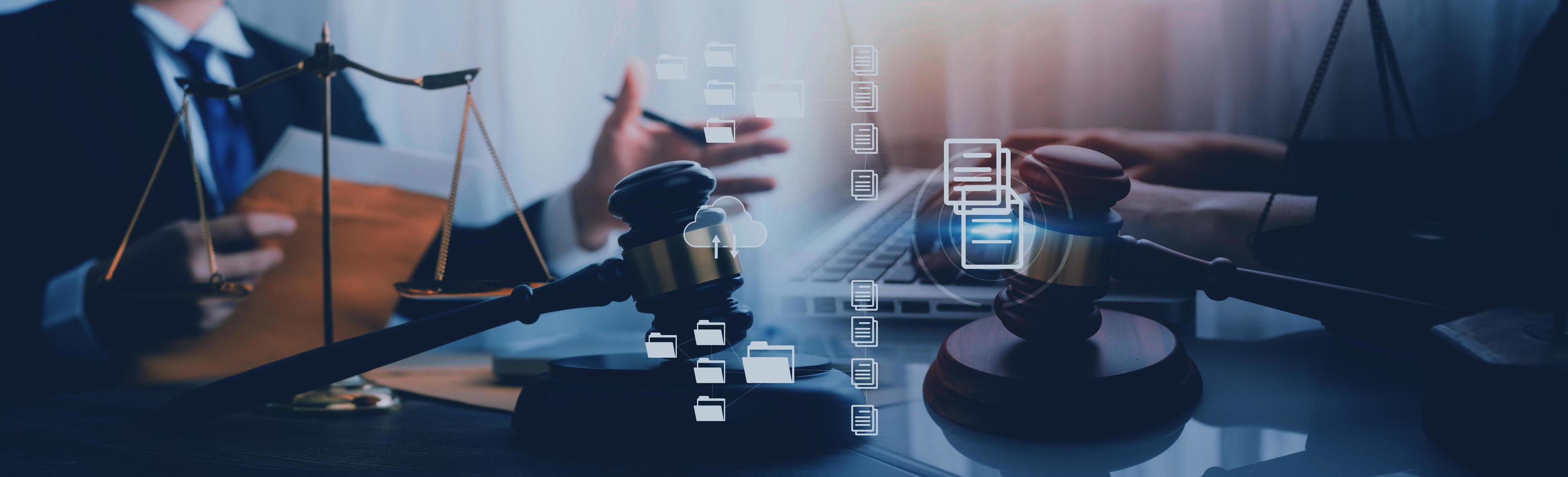 Justice and law concept.Male judge in a courtroom with the gavel, working with, computer and docking keyboard, eyeglasses, on table in morning light photo