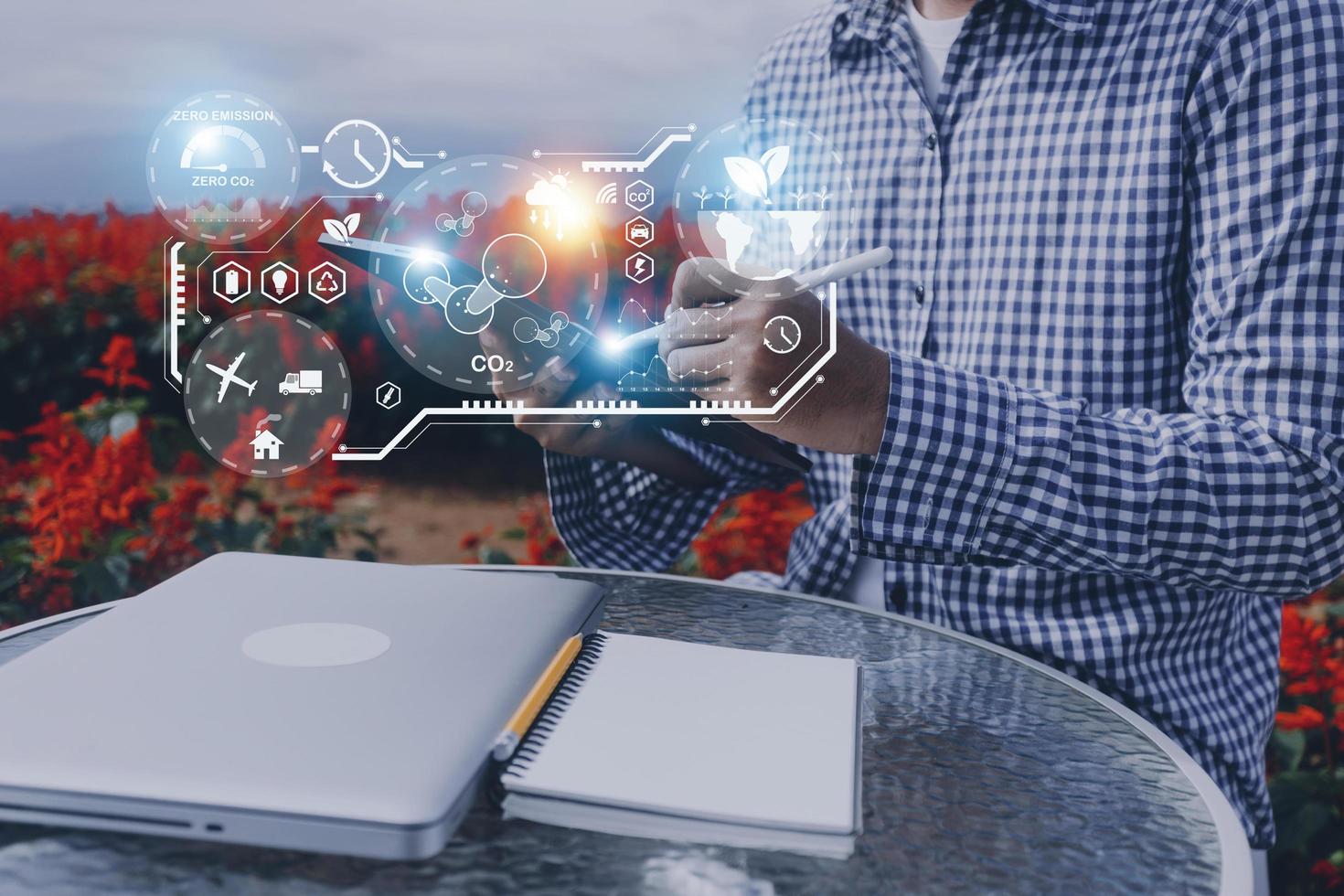 Selective focus. Architect team planning design apply renewable or solar energy on architectural building model with virtual reality technology hologram. Alternative green energy in future concept. photo