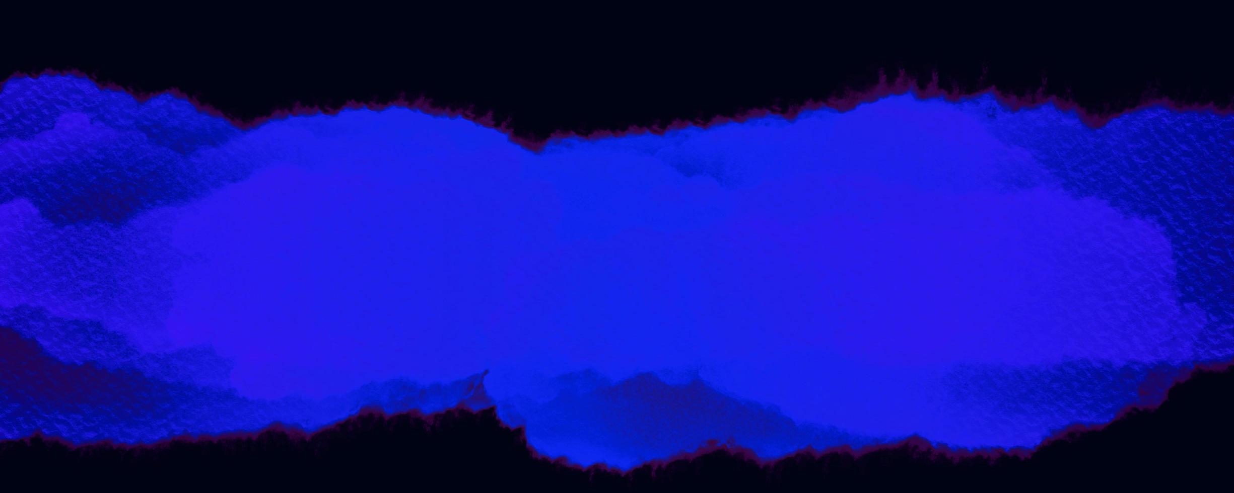 Blue watercolor on black background photo