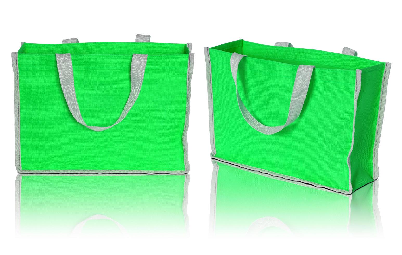 green shopping bag on white background photo