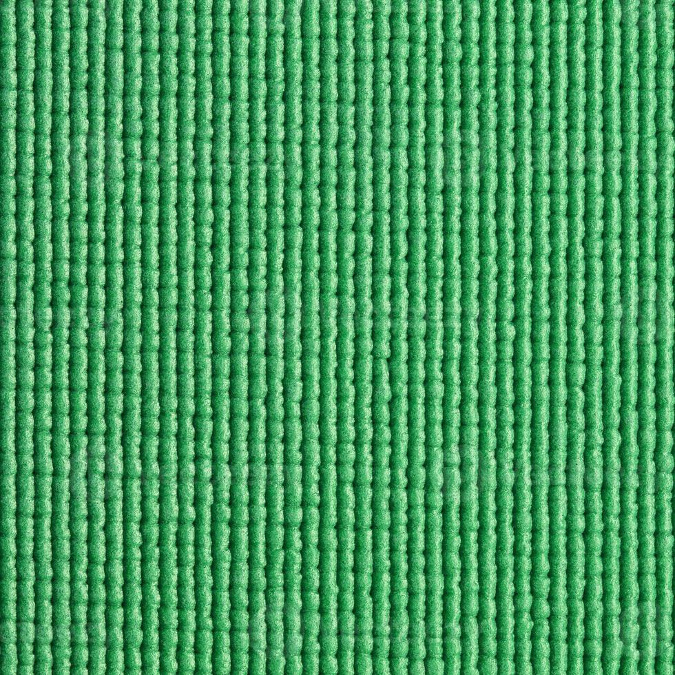 green yoga mat texture background photo