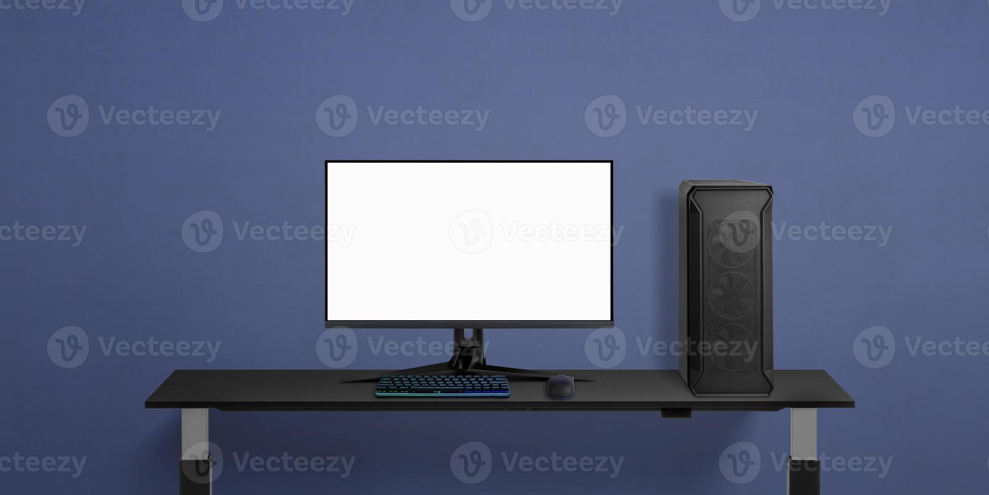 Gaming computer on desk. Isolated display for game promotion. Purple wall in background photo