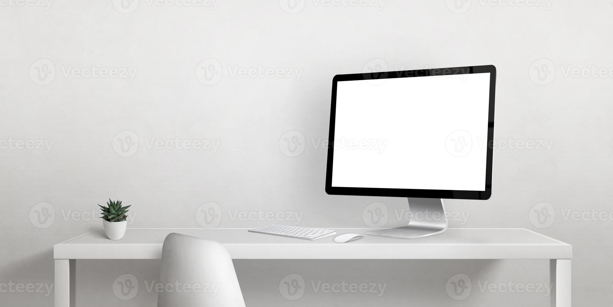 Computer display mockup on work desk with copy space beside on white wall. Isolated display screen for web page promotion photo