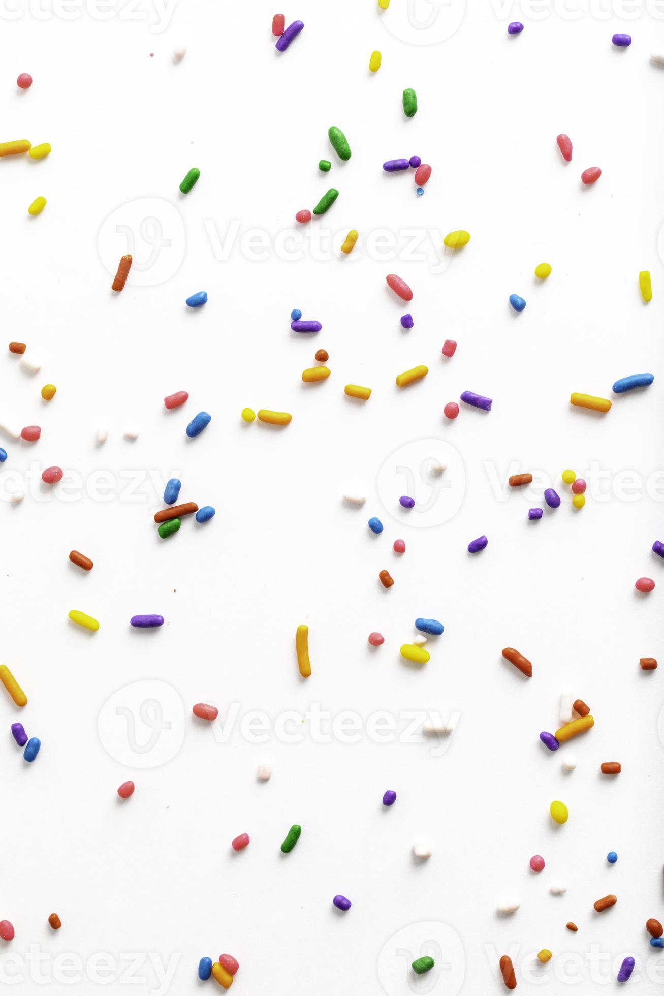 Rainbow Sprinkles on White Background 10228670 Stock Photo at Vecteezy