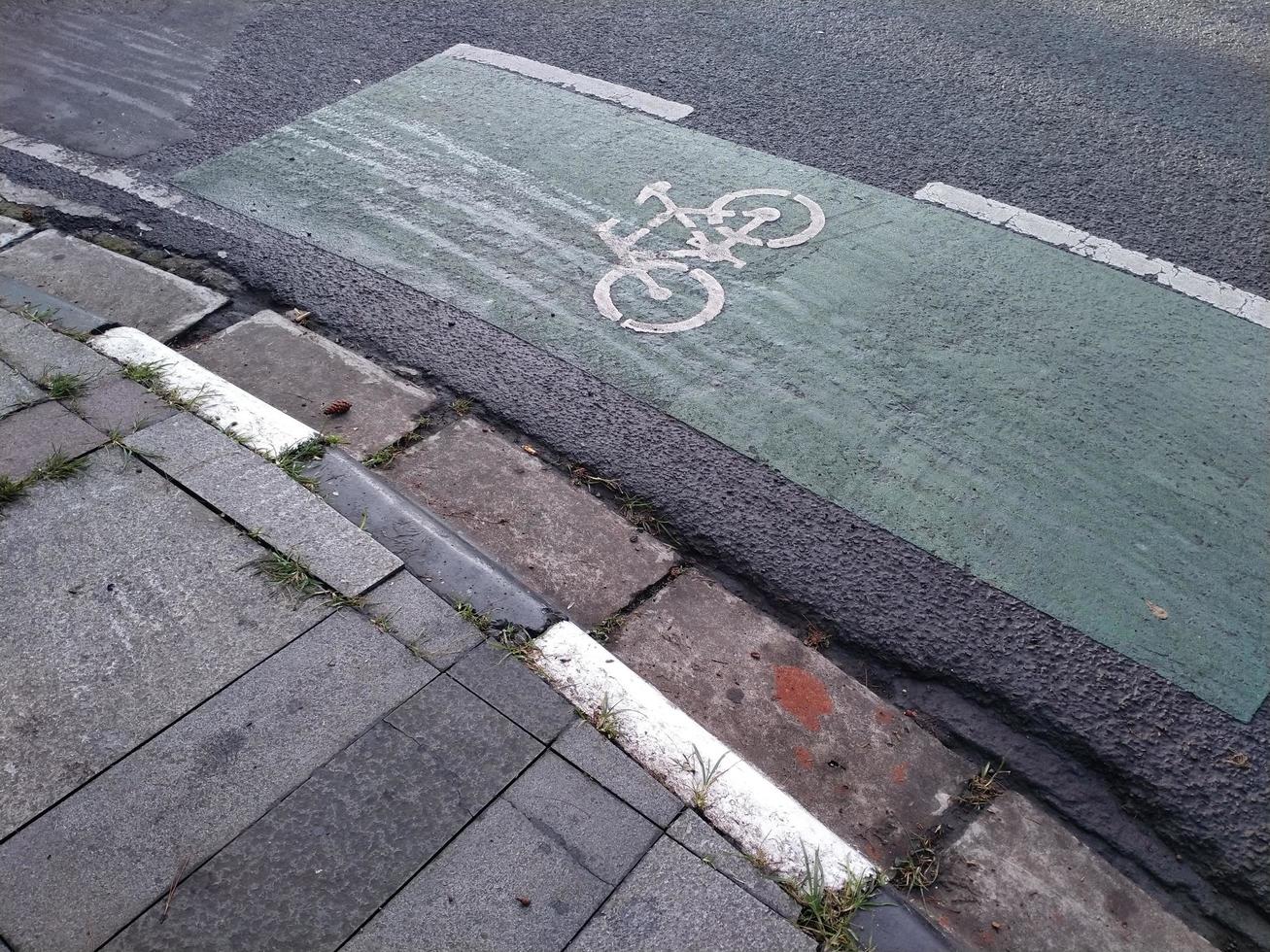 bicycle lane marker on the highway photo