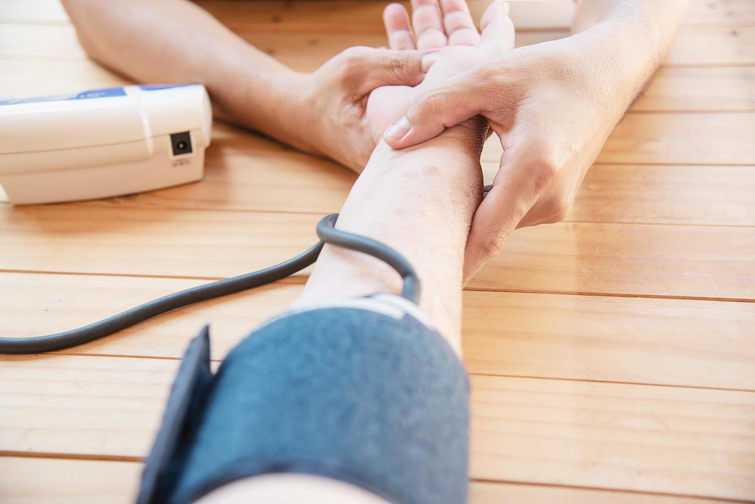 Old lady is being checked blood pressure using blood pressure monitor kid set - people with health care medical instrument set concept photo