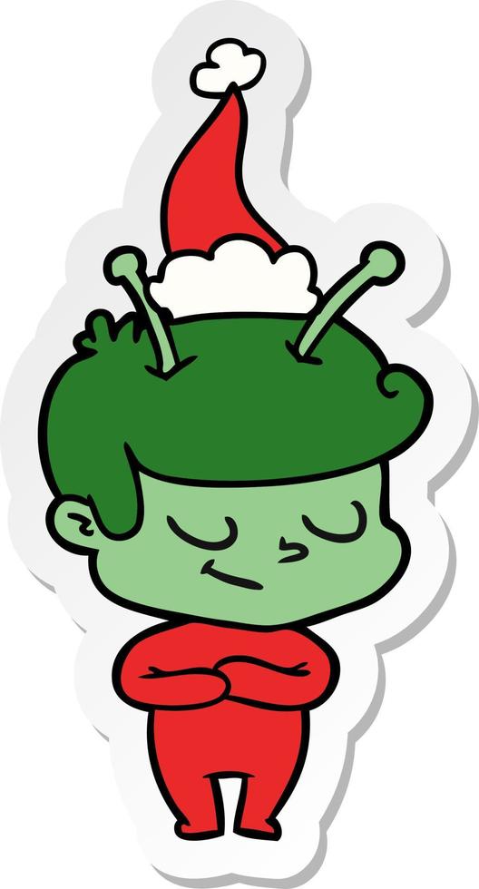 friendly sticker cartoon of a spaceman wearing santa hat vector