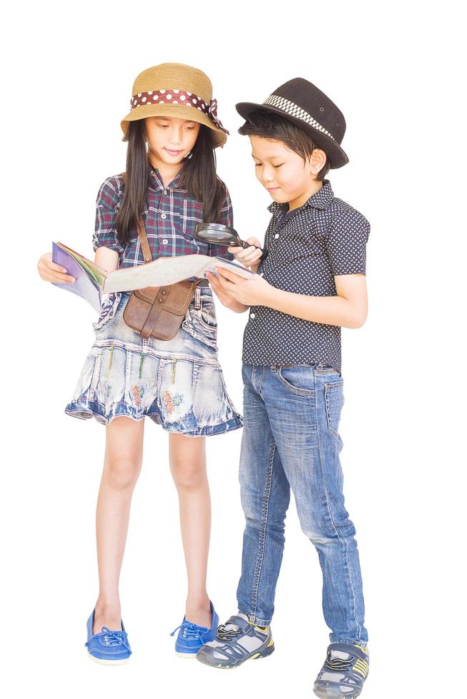 Asian boy and girl travelers are studying map prepare to go, isolated over white background photo