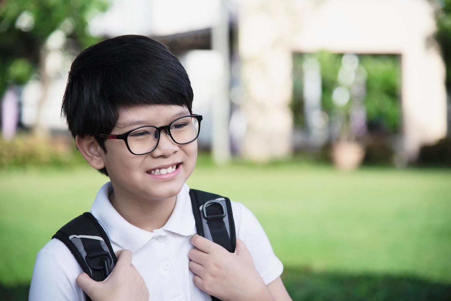 Young Asian Thailand boy happy going to school - children back to school concept. photo