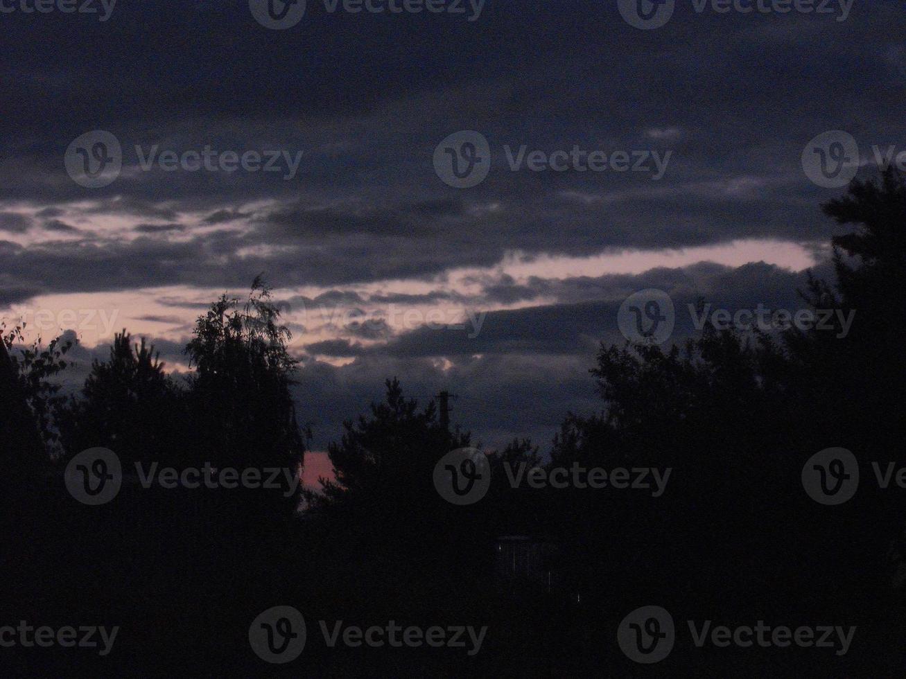 Morning dawn in the sky and a field in the village photo