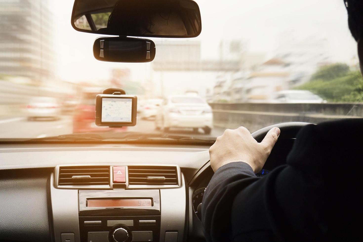 Business man is speedily driving a car photo